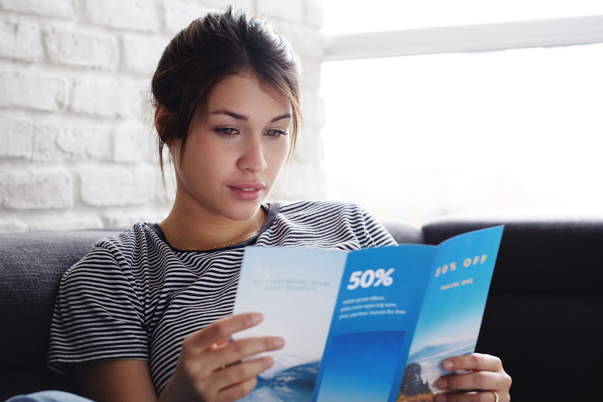 woman reading beauty salon leaflet